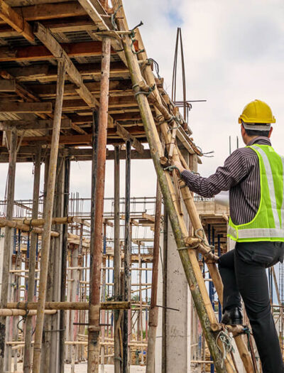 young-professional-engineer-worker-protective-helmet-blueprints-paper-hand-working-ladder-house-building-construction-site